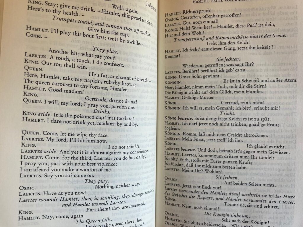 A photo of a double spread from the parallel text of Shakespeare's Hamlet, with English on the left and the German translation on the right.